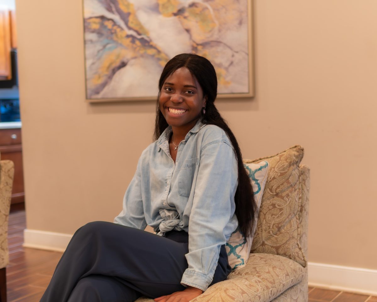 Woman smiling warmly at the event