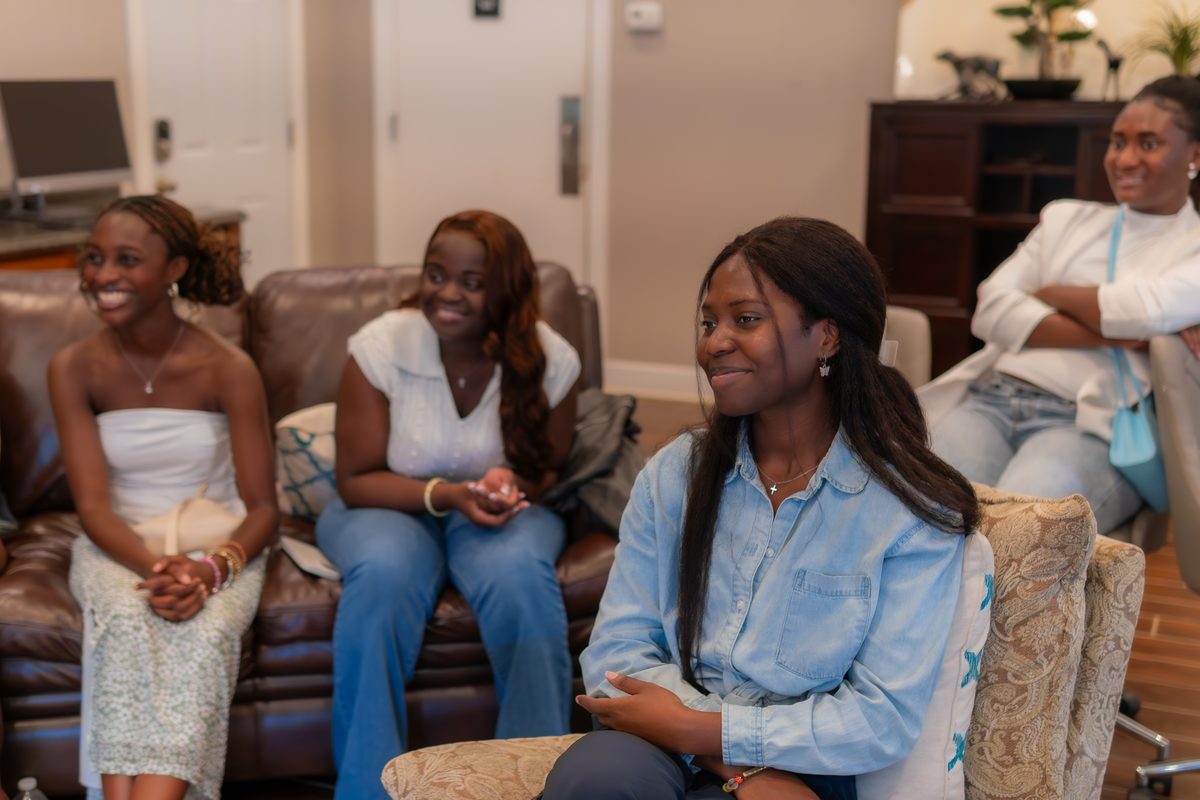 Women smiling and engaging together